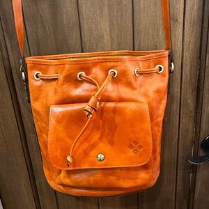 Patricia Nash Somers drawstring orange leather cross body bag